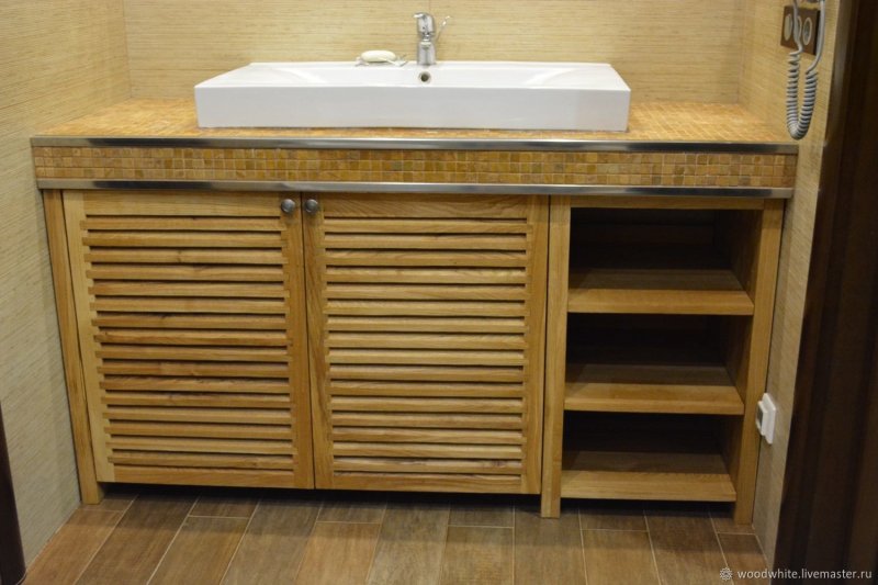 Wooden cabinet under the sink into the bathroom