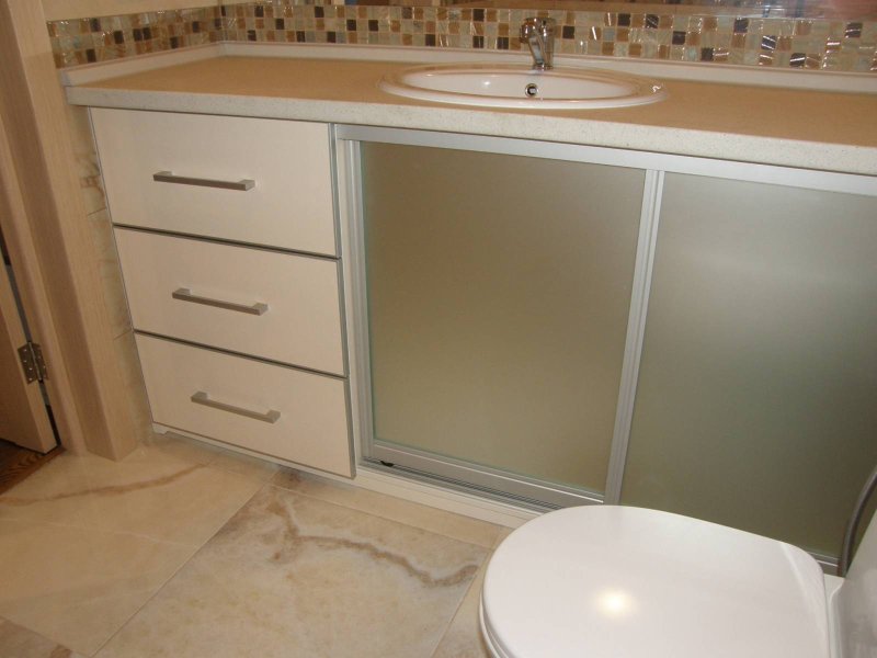 A cabinet under the bathroom