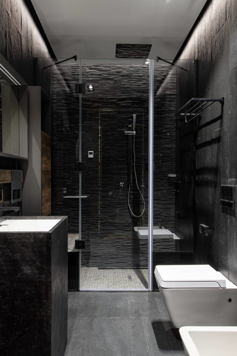 The bathroom is black shower