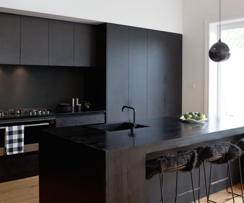 Black kitchen in the interior