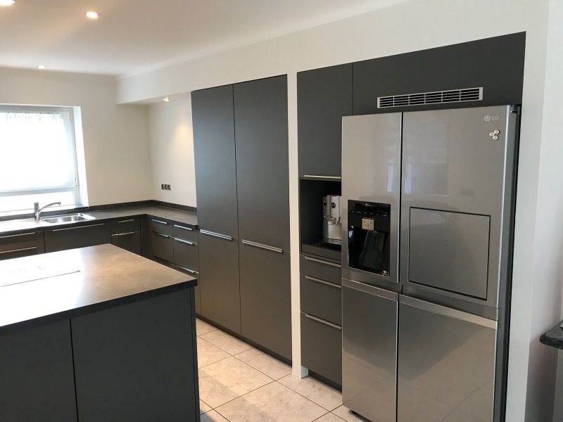 Kitchen with a large refrigerator