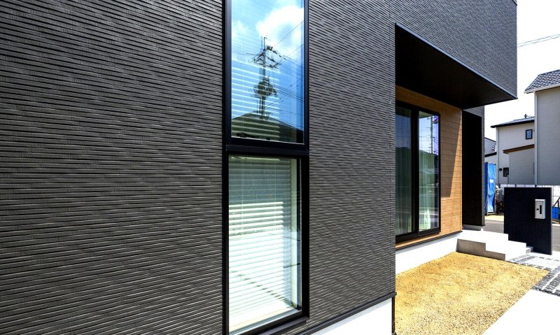 Fibrim -cement panels for a wood facade