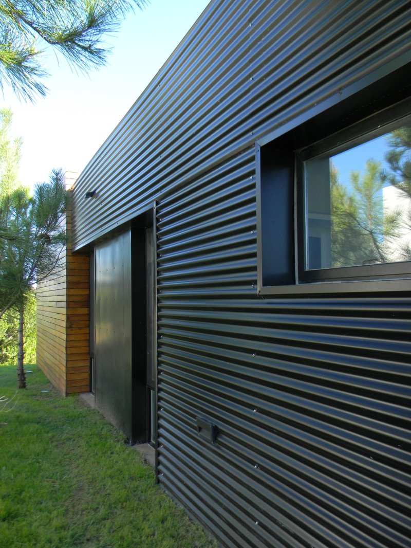 Corrugated board for the facade of the house