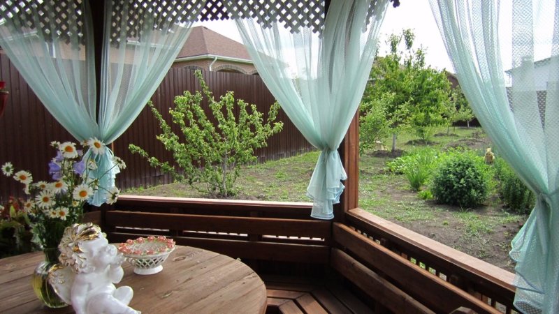 Curtains on the veranda in the country