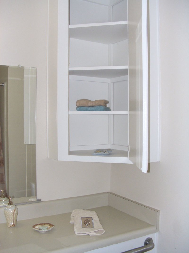 Corner cabinet in the bathroom