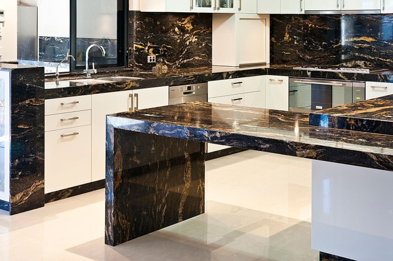 The countertop is black marble