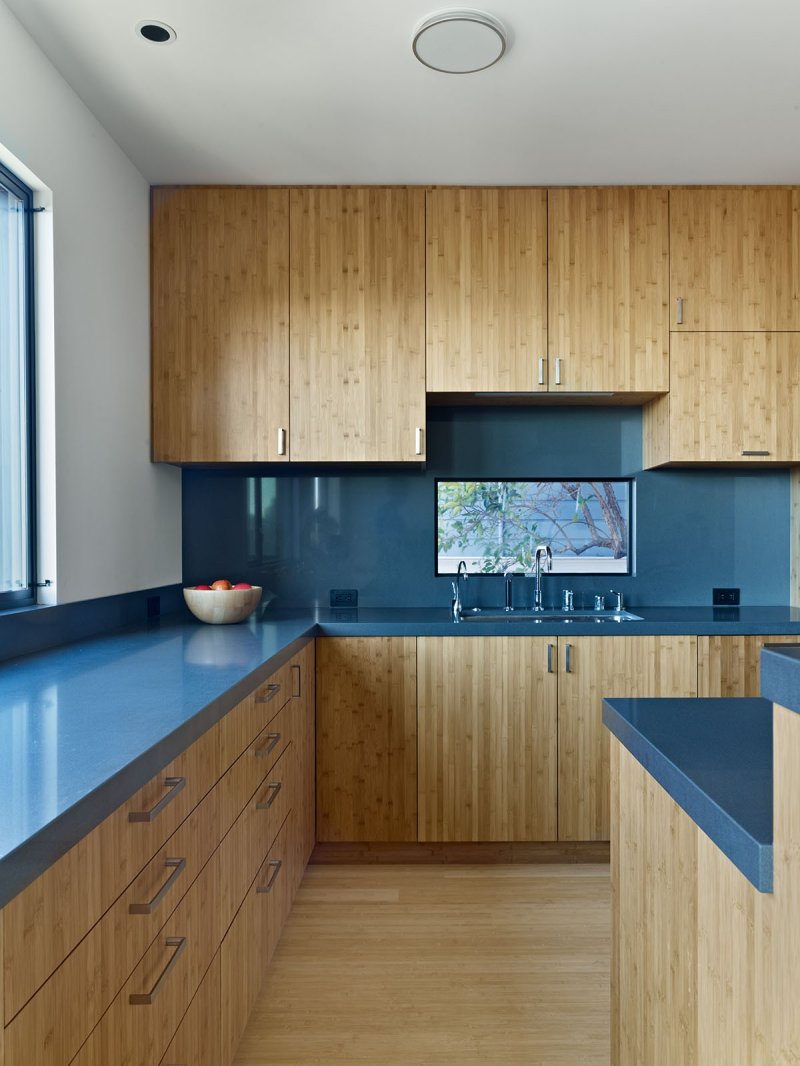 Blue kitchen with a wooden countertop