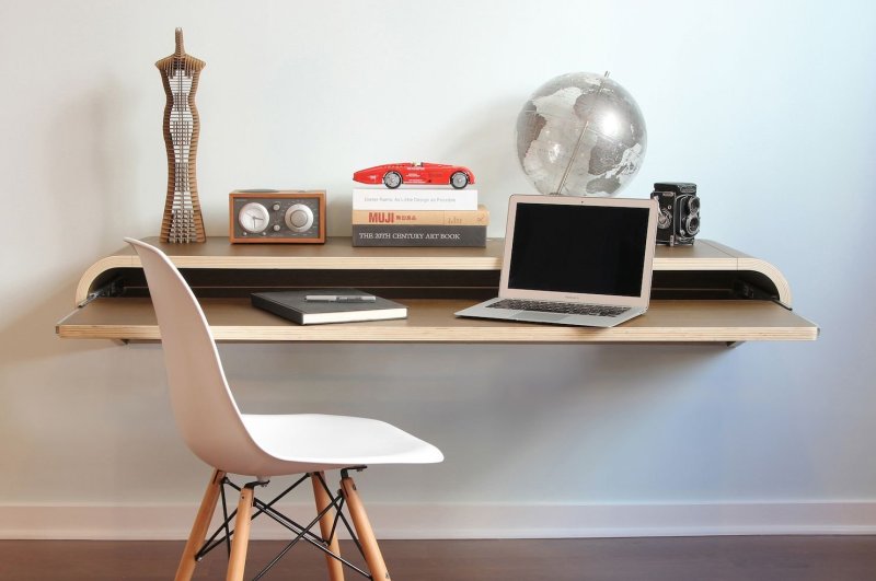 A hinged computer table