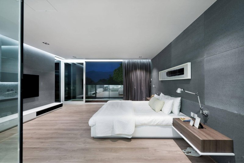 The design of the bedroom in the modern style of minimalism