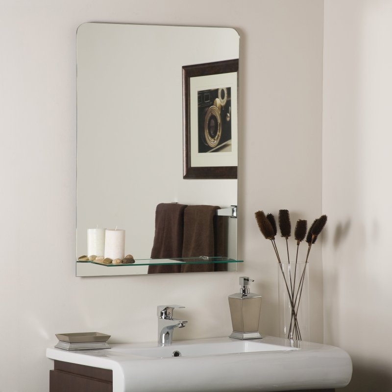 Mirror in the bathroom with a shelf