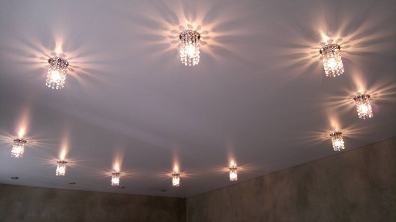 Stretch ceiling with a chandelier