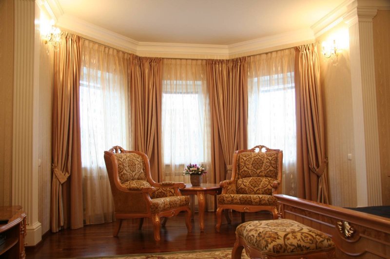 Curtains for a bay window in the living room classic