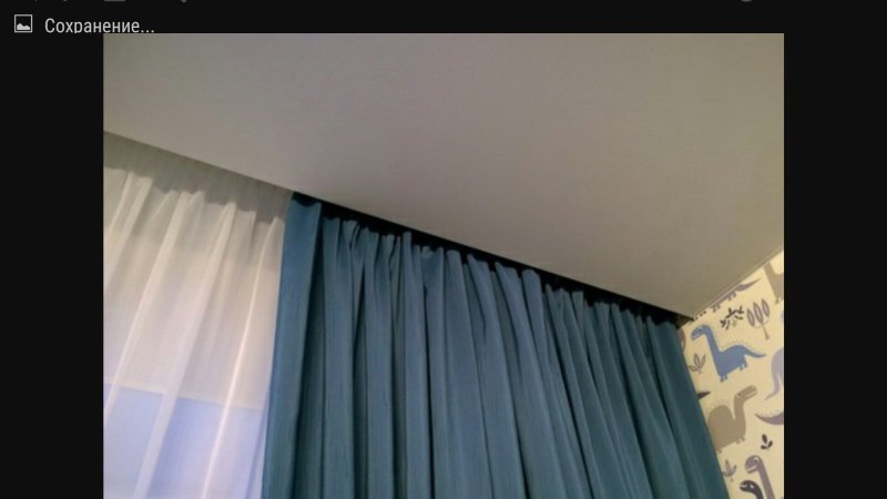 Stretch ceiling with a niche for curtains