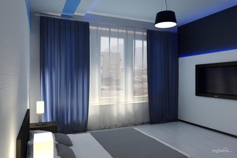 Blue curtains in the interior of the bedroom