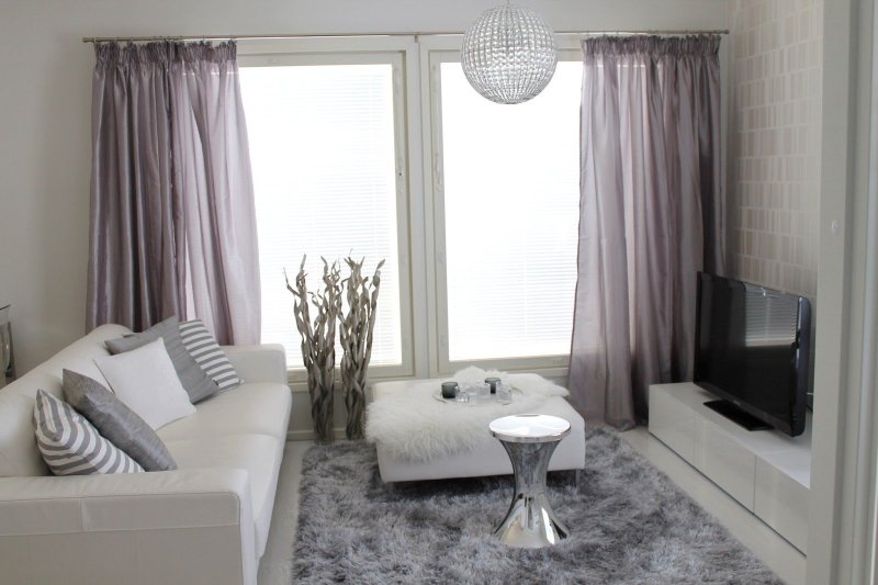 Gray curtains in the interior of the living room