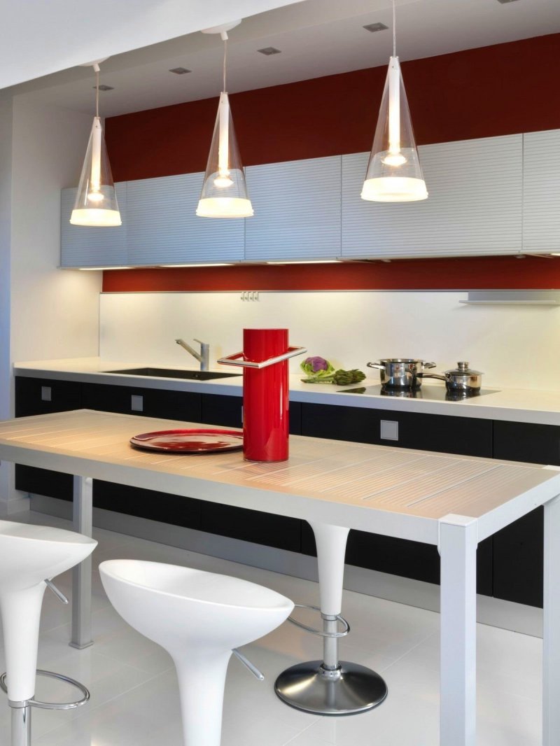 Lamps above the bar in the kitchen suspended