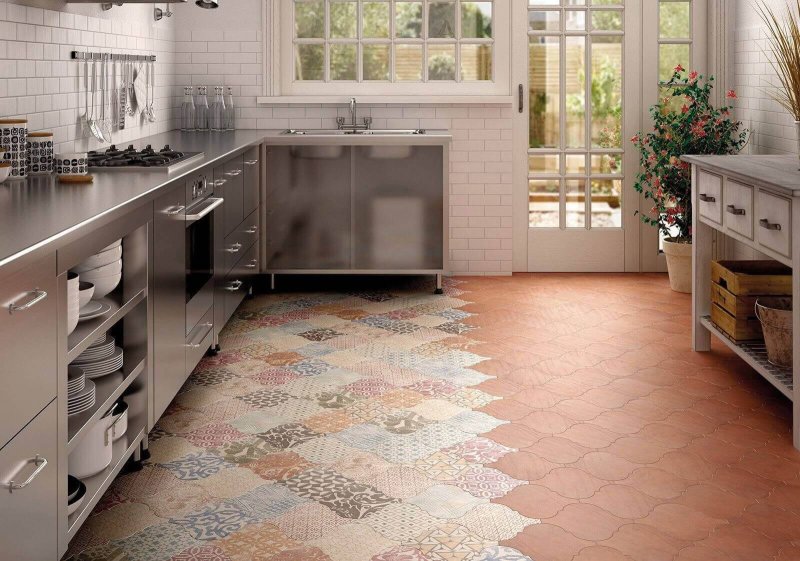 The interior of the kitchen with patchwork tiles a floor