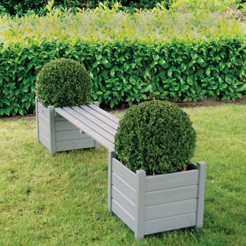 A bench with a flowerbed