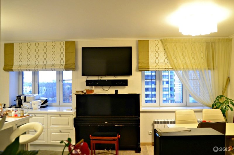 Roman curtains in the interior of the kitchen