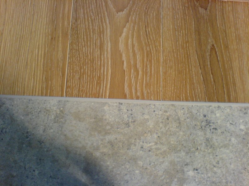 The joint between the laminate and tiles