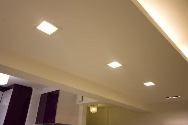 Square lamps in a stretch ceiling