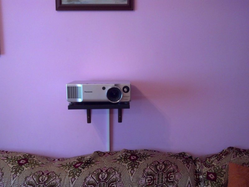 Shelf for the projector on the wall