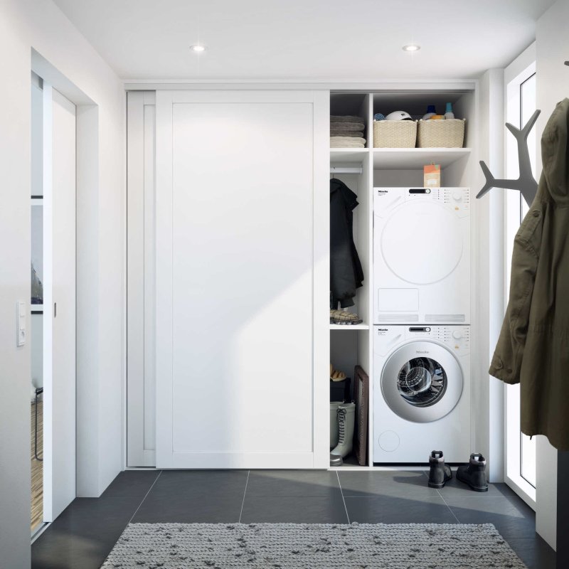 Washing machine in a closet in the corridor