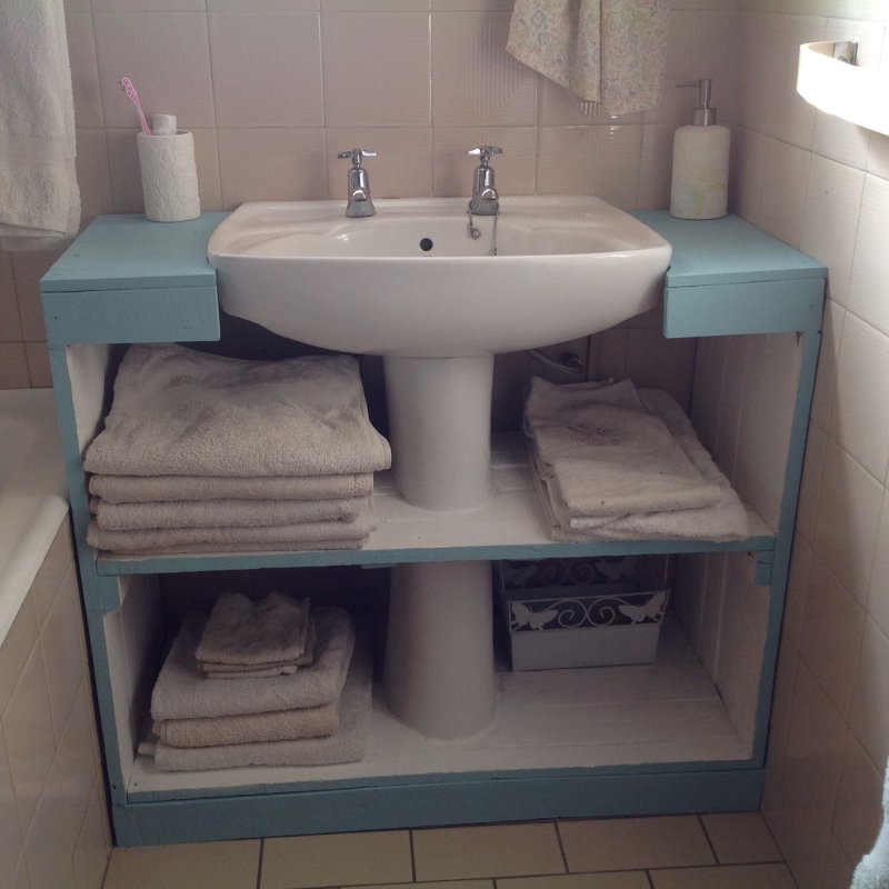 Shelf under the sink in the bathroom