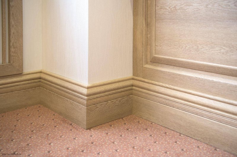 Wooden skirting board in the interior