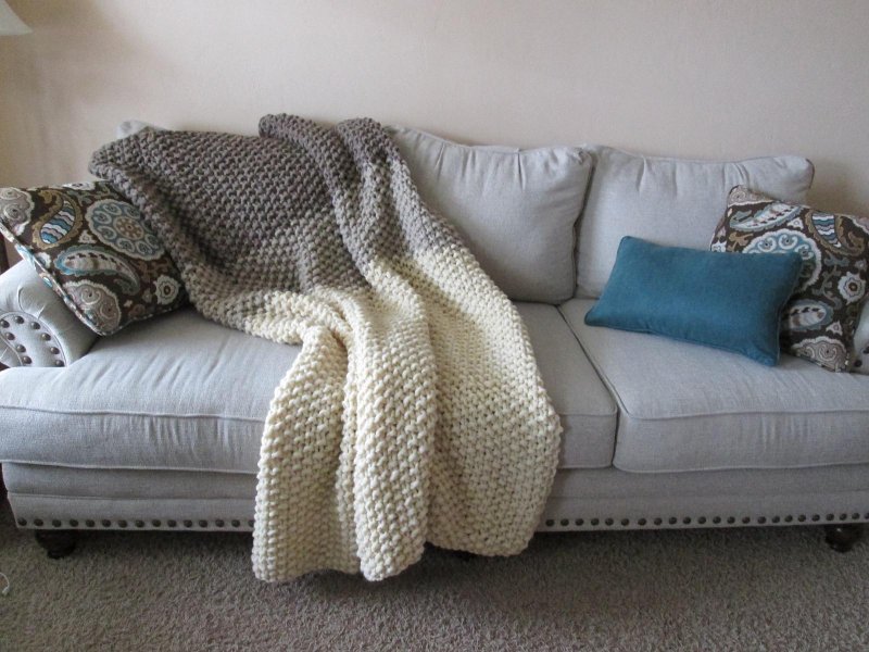 Knitted plaid on the sofa