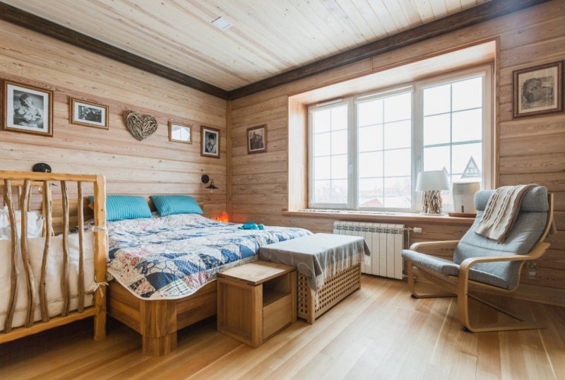 Bedroom interior in a wooden house