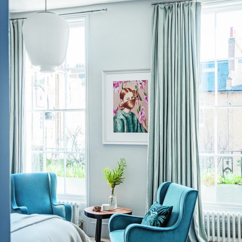 Blue curtains in the interior of the living room