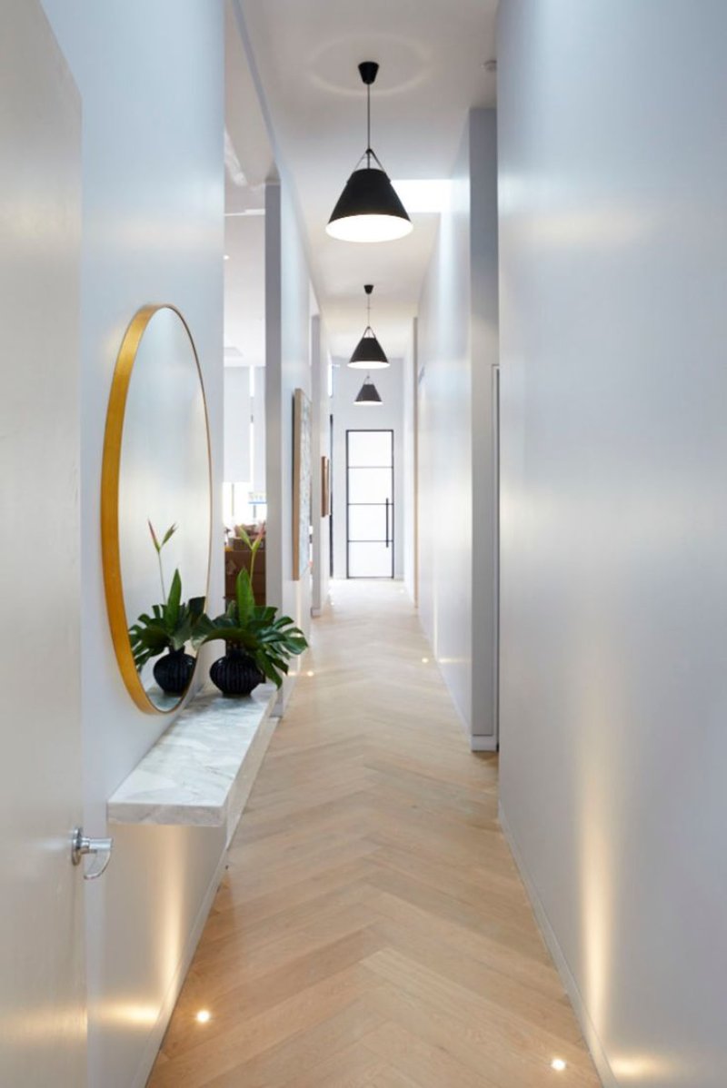 The interior of a long corridor in the apartment