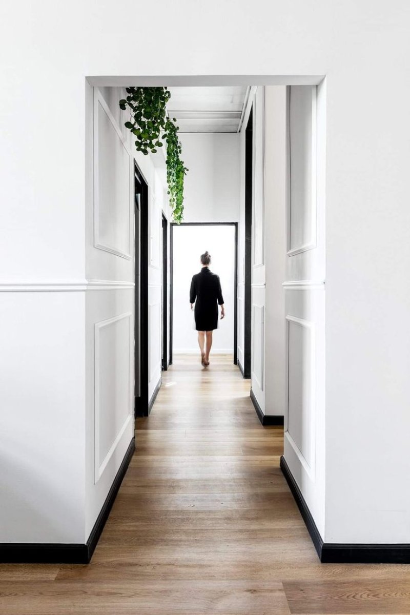 The interior of a long corridor in the apartment