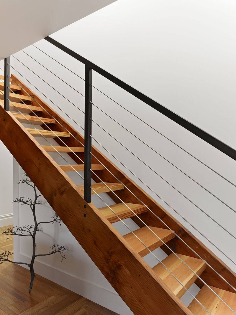 Wooden staircase with metal railings