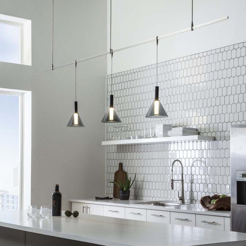 Track lamps above the kitchen