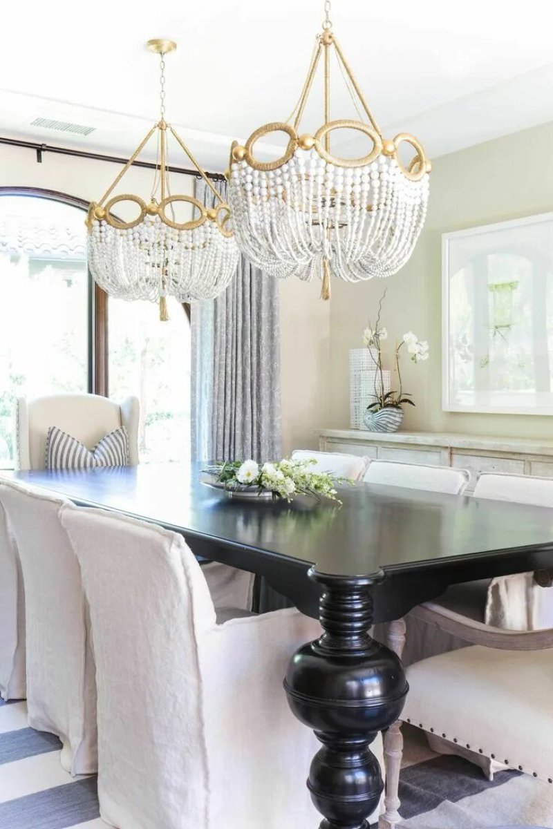 Chandeliers above the dining table in a modern style