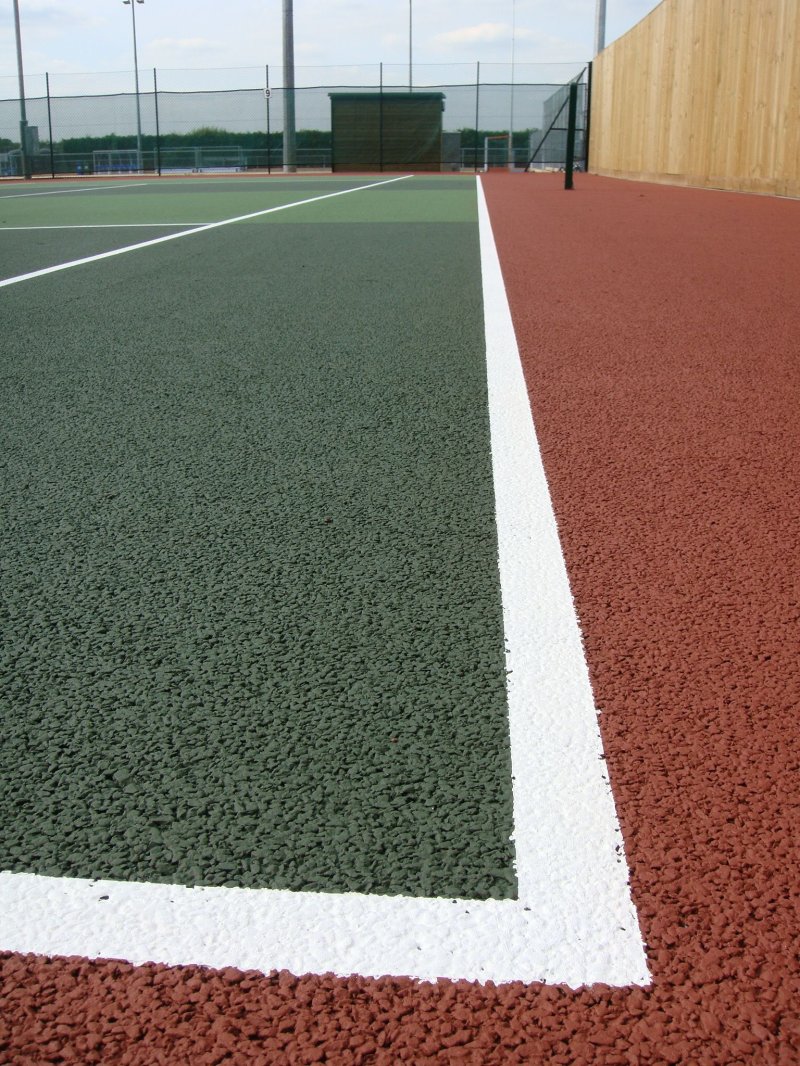 Tartan coating for sports grounds