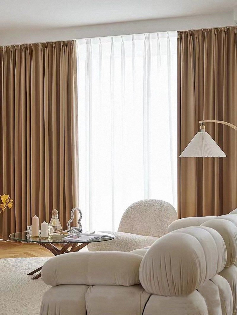 Beige curtains in the interior of the living room