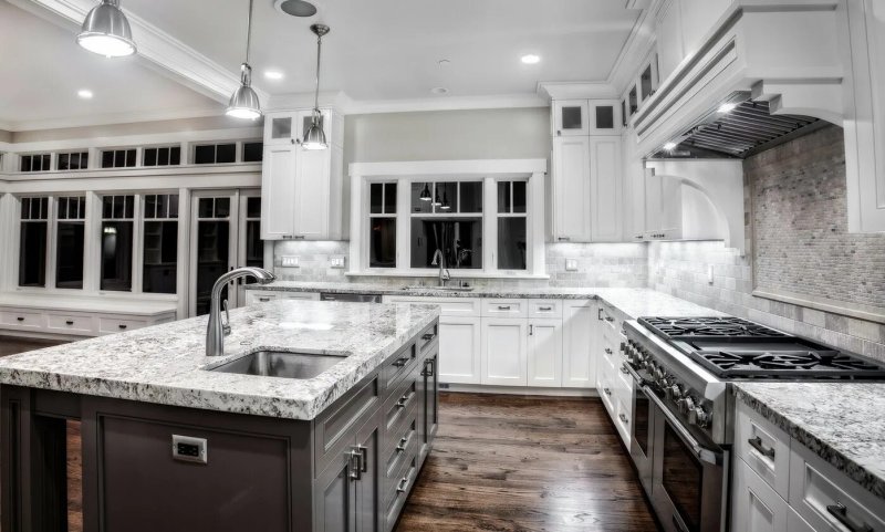 Gray kitchen with a marble countertop and apron