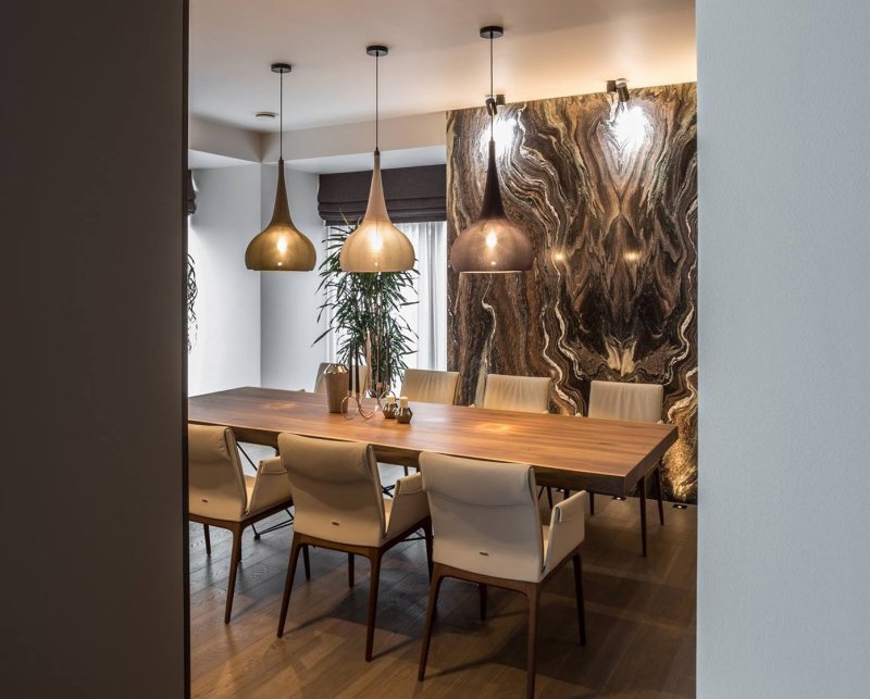 Chandeliers above the dining table in a modern style