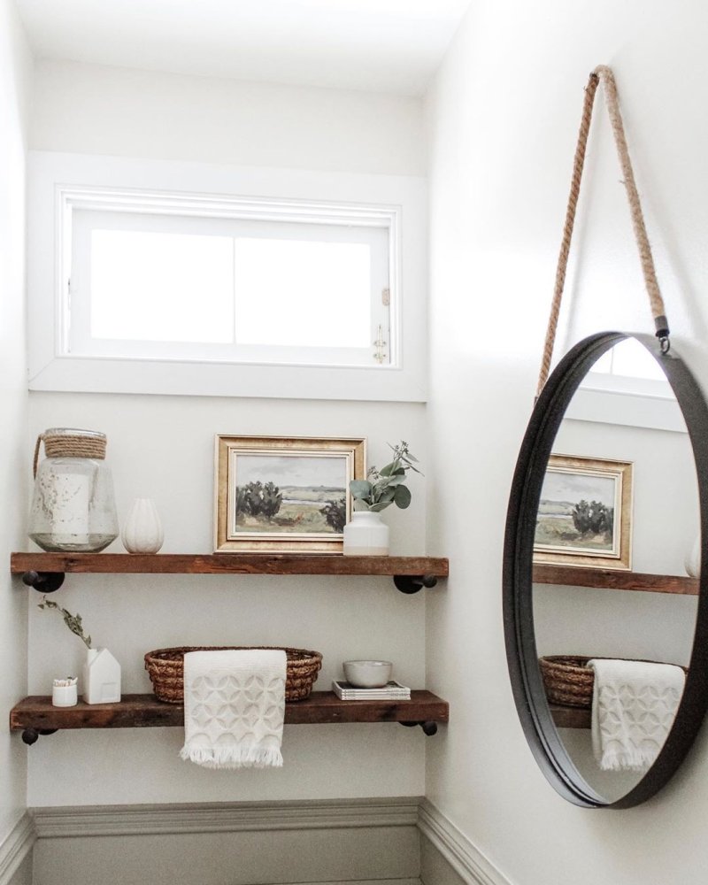 Round mirror in the bathroom in the interior