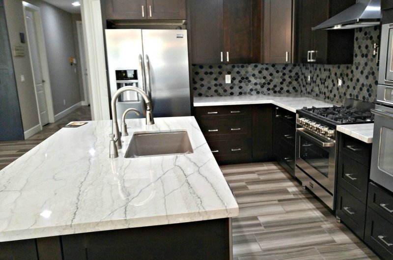 Gray kitchen with a marble tabletop