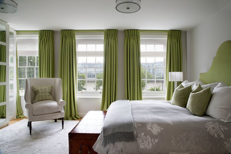 Bedroom interior with green curtains