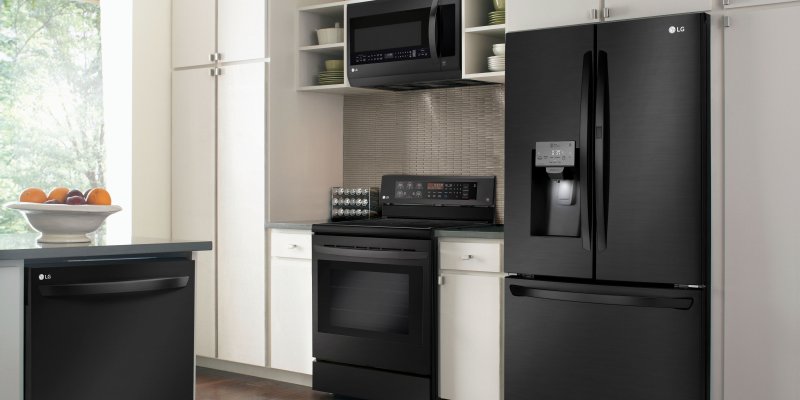 Kitchen with a black refrigerator design