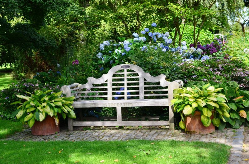 Pergola with a bench shady garden