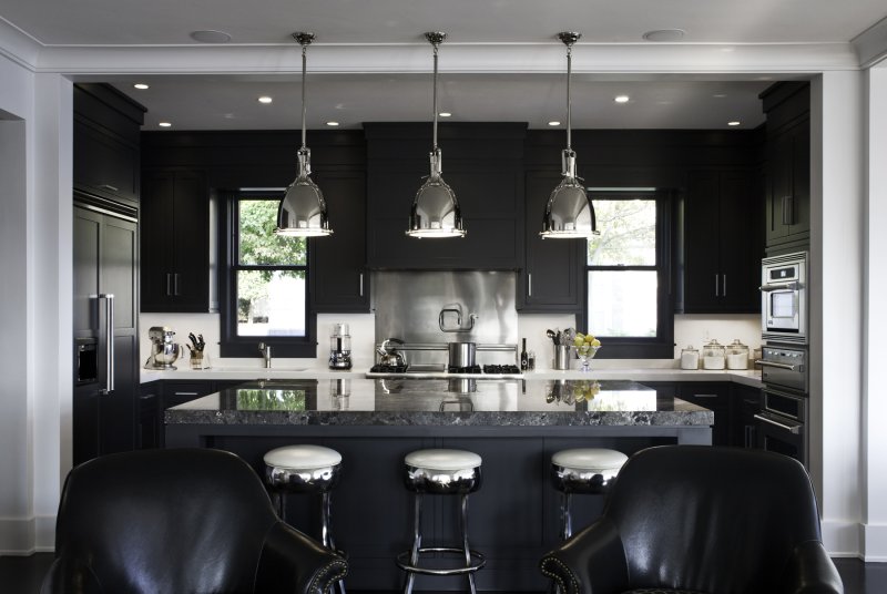 The interior of the kitchen in dark colors