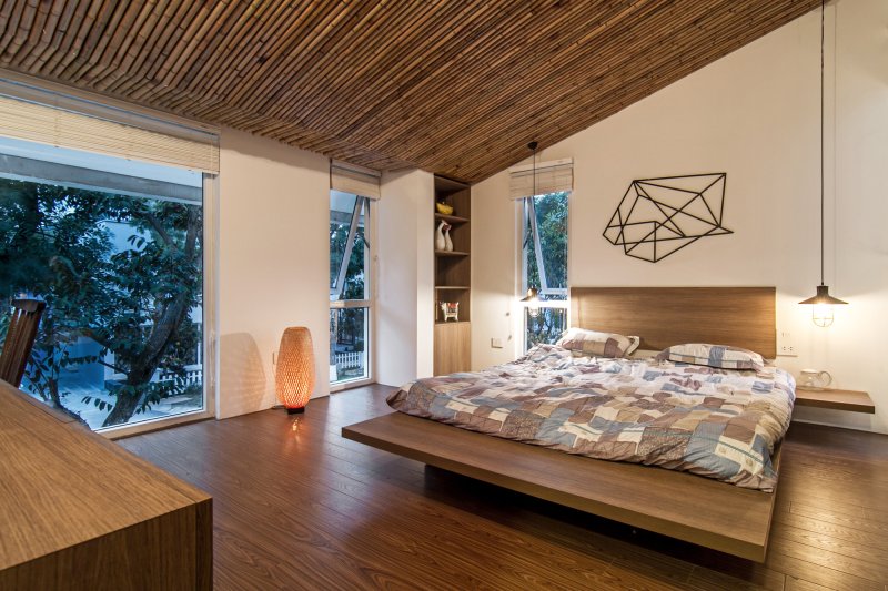 A bedroom in a modern style with a tree