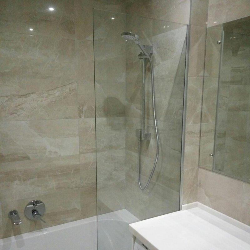 Bath with a glass partition