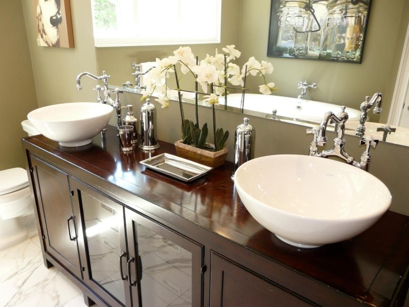 Bathroom with a large mirror above the sink